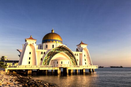 Sunset over Masjid selat Mosque in Malacca Malaysiaの写真素材