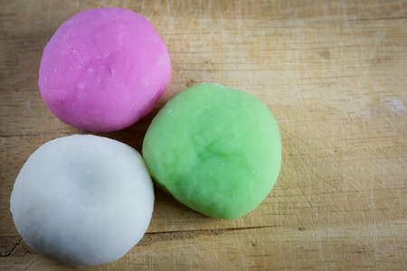 Colorful Daifuku, Japan dessert on wooden plate, Moji is very delicious.の写真素材