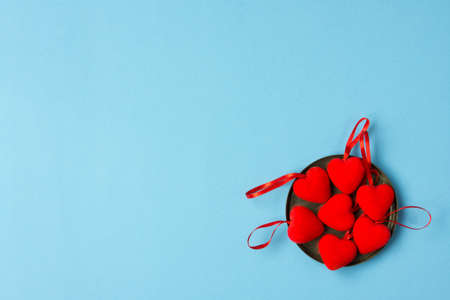 Red heart on blue background, copy spaceの写真素材