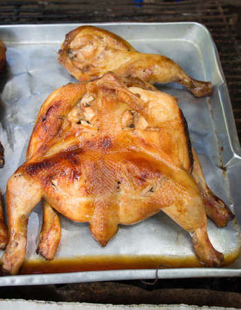 roasted chicken on silver plateの写真素材