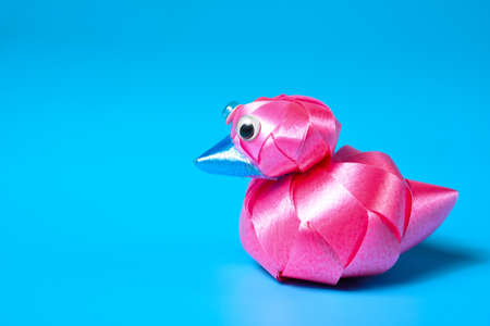 Pink hand-made duck ribbon as a gift for Christmas and New Year, wedding and birthday.の写真素材
