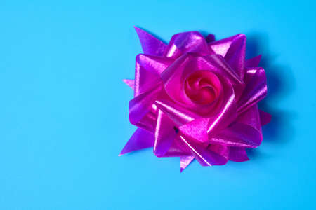 Pink hand-made rose ribbon as a gift for Christmas and New Year, wedding and birthday.
