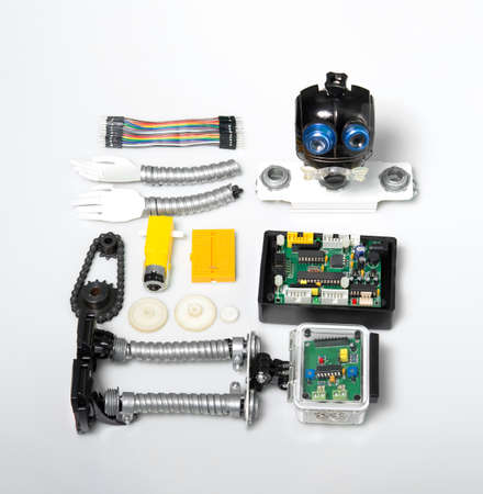 Close-up of DIY robot and microcontrollers board in robotics laboratory school.