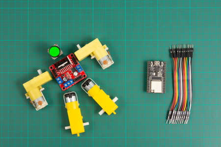 Close-up of DIY robot and microcontrollers board in robotics laboratory school.