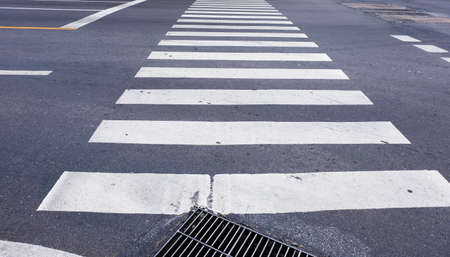 Crosswalk on the road for safety when people walking cross the street.