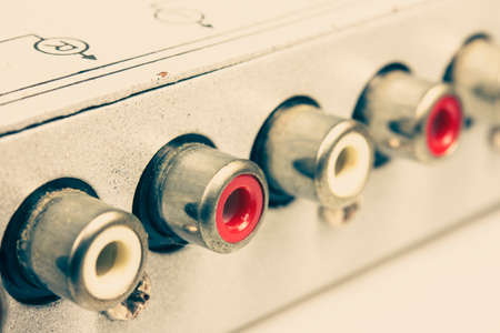 Audio receiver back panel with inputs output for connecting equipment and output to amplifier in vintage style.の写真素材