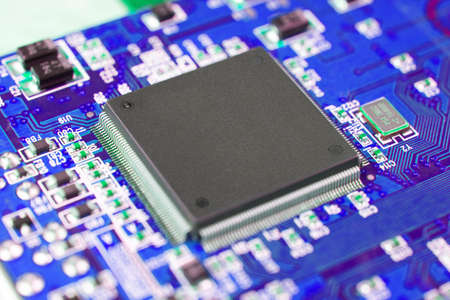 Blue electronic computer motherboard, digital chip with copy space.