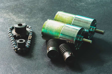 Motor, worm gear, drive sprockets and industrial driving roller chains. Vintage style photo.の写真素材