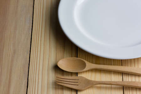 Laxury plate and fork on the wooder tableの写真素材
