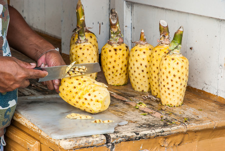 Carving peeled off pineapple, food decorationの写真素材
