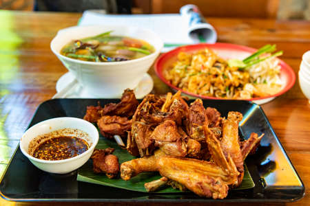 Fried chicken with spicy sauce, Thai style. one of famous gourmet in Thailandの写真素材