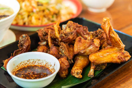 Fried chicken with spicy sauce, Thai style. one of famous gourmet in Thailandの写真素材