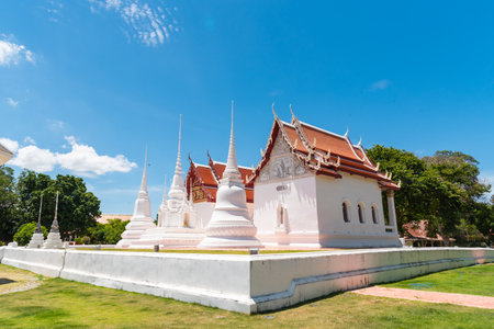 three white pagoda and chapel in Wat Uposatharam, old temple in Uthai thani province, Thailandの写真素材