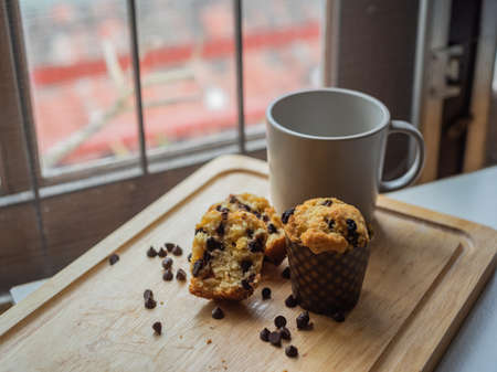 Homemade chocolate chip and raisin muffins in paper cup.の写真素材