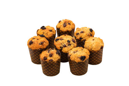 Isolated homemade chocolate chip and raisin muffins in paper cup.の写真素材