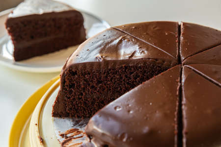Homemade round chocolate cake with chocolate frosting.の写真素材