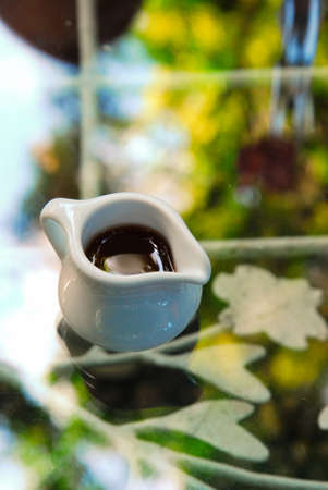 honey syrup served in small and white ceramic jar.の写真素材