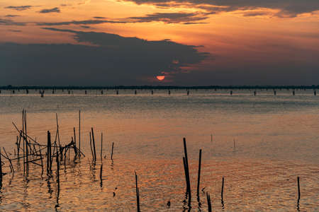 beauty sunset view in a cloudy day. At Koh yor, Songkla province, Thailand.の写真素材