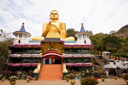 big golden buddha in dambulla, sri lankaの写真素材