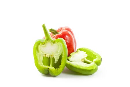 red and green paprikas on white backgroundの写真素材