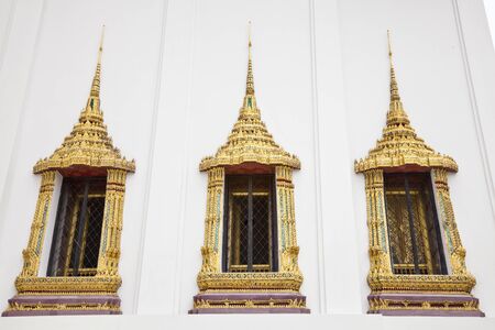 thai style temple window at wat phra kaew, bangkok, thailandの写真素材