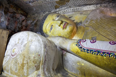 the reclining buddha statue in dambulla cave, sri lankaのeditorial素材
