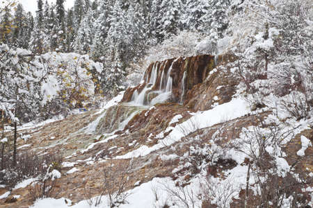 waterfalls in the winter, huanglong valley, chinaの写真素材