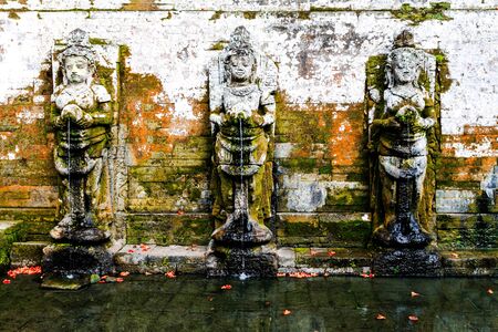 fountain in ancient balinese temple, bali, indonesiaの写真素材
