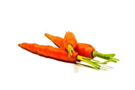 Baby carrots isolated on white backgroundの写真素材