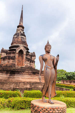 Standing buddha statue in sukhothai historical park, sukhothai province, thailandの写真素材