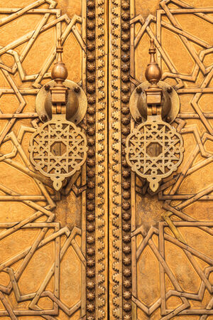 Golden door at royal palace in fez, moroccoの写真素材