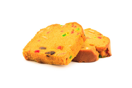 Sliced fruitcake on white backgroundの写真素材
