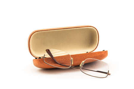 A pair of classic eyeglasses and case on white backgroundの写真素材