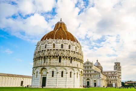 Pisa, Italy - October 19, 2015 : View of the famous buildings in the Square of Miracles and tourists in Pisa, Italy on October 19, 2015.のeditorial素材