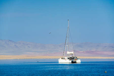 White ship in the South Pacific Ocean at Paracas Peruの写真素材