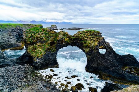 Arnarstapi Arch near Arnarstapi Village at the southern side of Snaefellsnes Penisula Icelandの写真素材