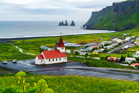 View of church at the village of Vik in southern Icelandの写真素材