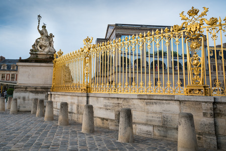 Golden fence and sculpture at Versailles Palace in Franceのeditorial素材