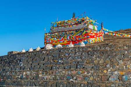 Sichuan, China - April 8, 2017 : Prayer flags on the hill at Zheduo Shan Pass Kangding, Sichuan, Chinaの写真素材