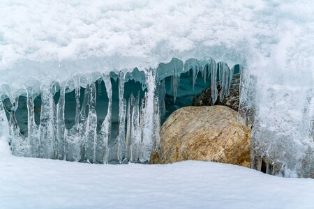 Icicles at ice cave in Frozen Lake Baikal in winterの写真素材