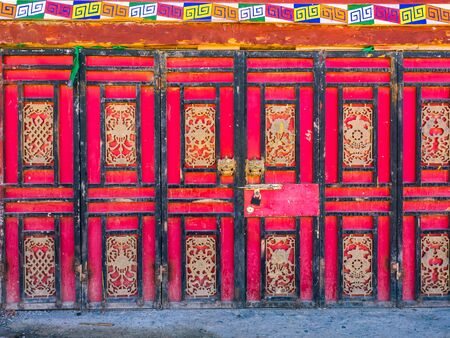 Traditional tibetan style door in Sichuan, Chinaの写真素材