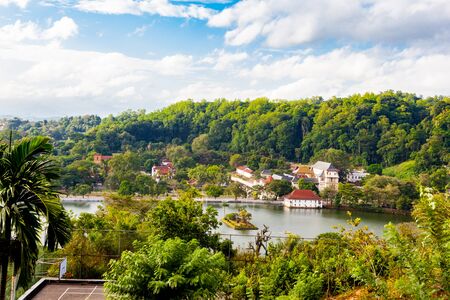 View of the Sacred Temple of Tooth Relic at Mogambara Lake Shore in Kandy, Sri Lankaの写真素材