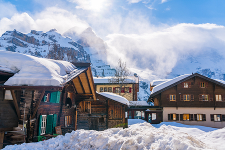 View of snowy Murren Village in sunny day with the beautiful high mountain in the backgroundの写真素材