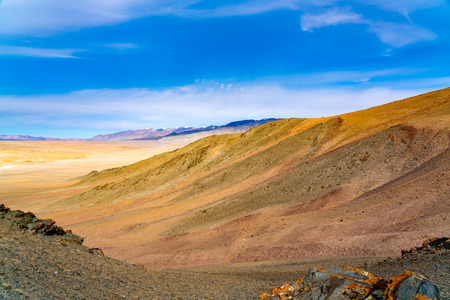 Beautiful landscape of Ulgii in Mongolia with the high mountain and the sandy valley in sunny dayの写真素材