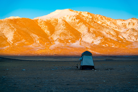 Light of sunset shine on the the beautiful snow mountain in the eveningの写真素材