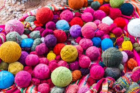 Balls of wool natural dyeing in a woven factory at Cusco, Peruの写真素材