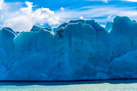 View of blue ice of Glacier Grey and Grey Lake in sunny day at Torres del Paine National Park, Chile