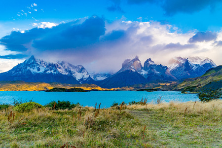 Beautiful scenic landscape of National Park Torres del Paine with Pehoe Lake and foggy mountain in the evening, Chileのeditorial素材