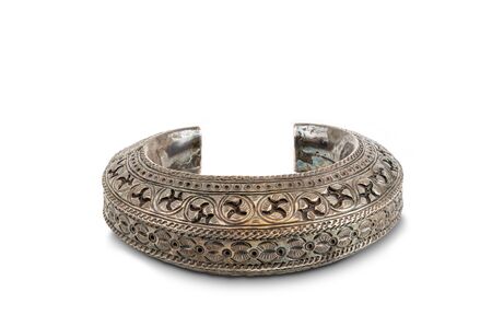 Thai style ancient handcrafted silver bracelet on white background with clipping path.の写真素材