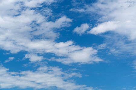 Beautiful blue sky with white cloud. Fluffy clouds moving in the wind on the blue sky.